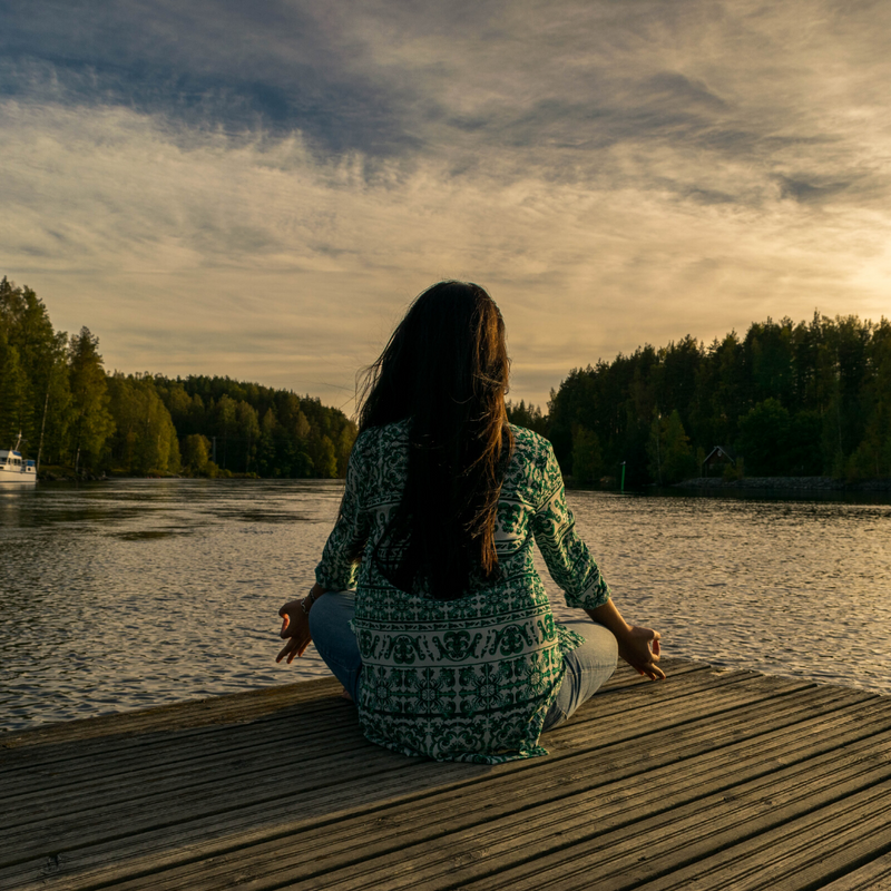 Woman meditating and grounding