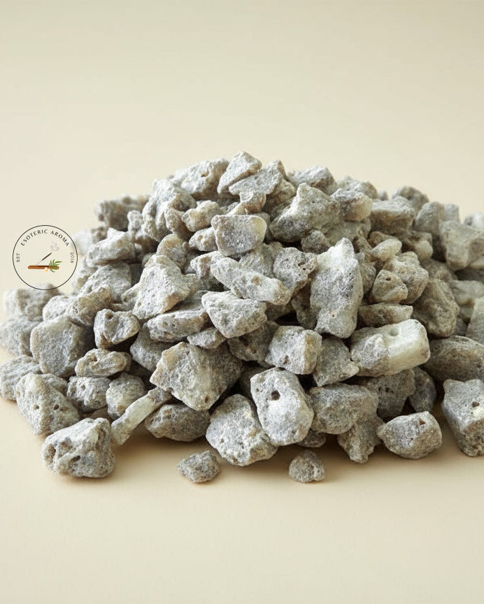 Resin incense in a pile on a creamy seamless background