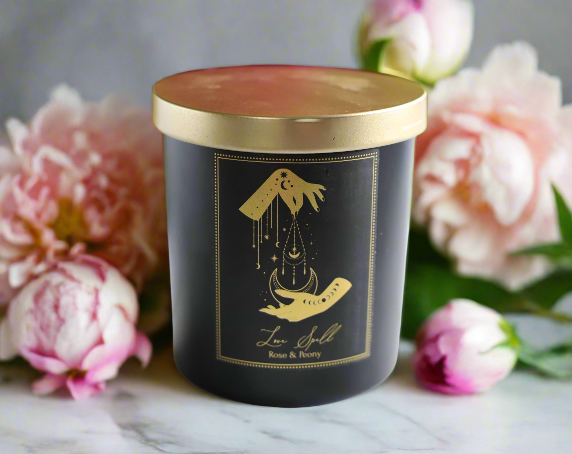 Love Ritual Candle with rose petals and crystals in a boho ritual setting