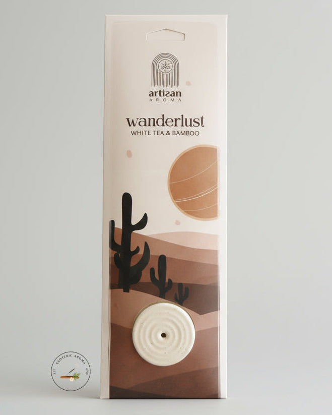 Artisan Aromas wanderlust product packaging on a light gray background