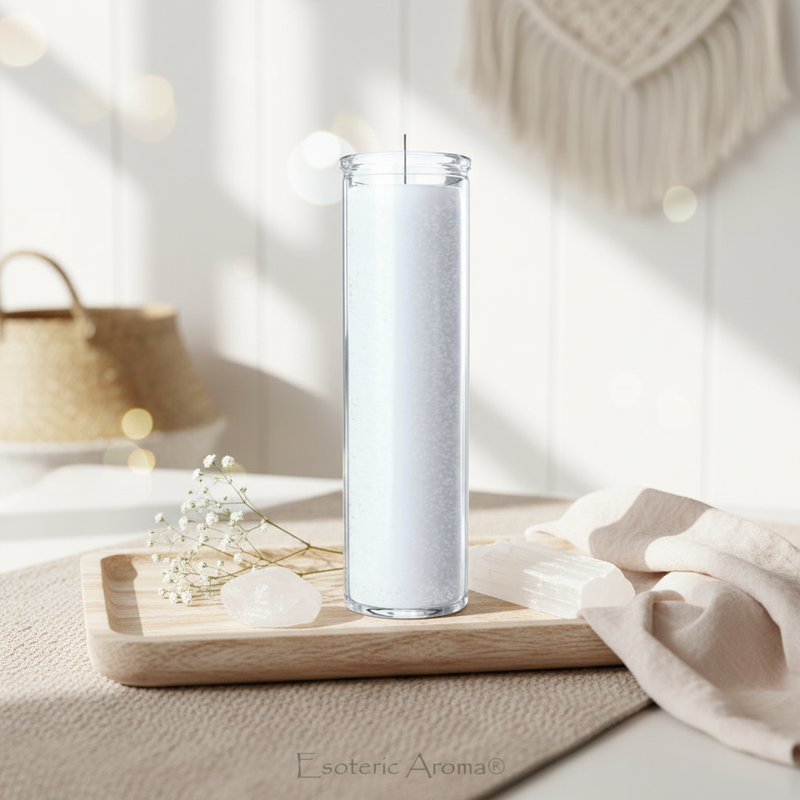 White candle in a tall glass jar on a wooden tray with soft lighting and neutral colors
