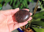 Polished Garnet palm stone